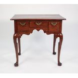 A GEORGE II RED WALNUT LOW BOY, the plain top with thumb moulded edge above three ovolo moulded