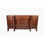 WILLIAM IV FIGURED MAHOGANY INVERTED BREAKFRONT SIDEBOARD, the shaped, crossbanded top above a