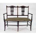 EDWARDIAN DARK STAINED MAHOGANY DRAWING ROOM DOUBLE CHAIR BACK SETTEE, with shaped top rail above