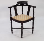 A VICTORIAN CORNER CHAIR, HAVING SHAPED TOP RAIL OVER PIERCED BACK SPLATS, PAD SEAT WITH STRIPED