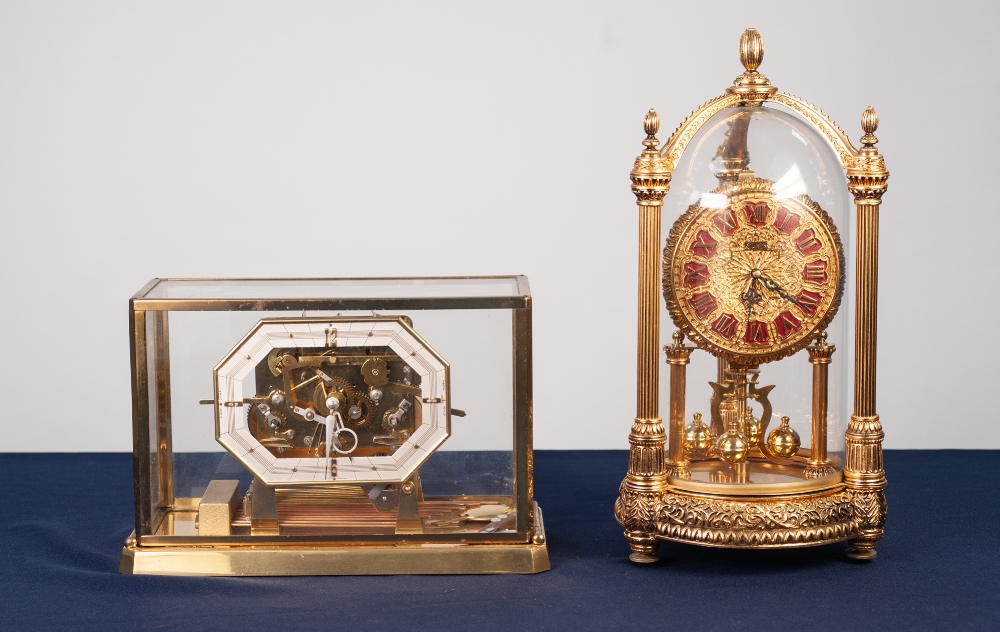 KERN, MODERN REPRODUCTION GILT METAL ANNIVERSARY CLOCK, with twelve part Roman dial and glass case