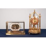 KERN, MODERN REPRODUCTION GILT METAL ANNIVERSARY CLOCK, with twelve part Roman dial and glass case