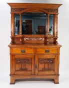 EARLY TWENTIETH CENTURY ARTS AND CRAFTS CARVED OAK MIRROR BACK SIDEBOARD, the canopy top with