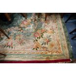 LARGE HEAVILY QUALITY WASHED CHINESE CARPET, of Aubusson design with large oval cream and floral