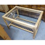 A LACQUERED BAMBOO OBLONG COFFEE TABLE WITH GLASS TOP AND UNDER SHELF