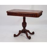 EARLY NINETEENTH CENTURY CARVED AND FIGURED MAHOGANY PEDESTAL TEA TABLE, the rounded oblong fold-