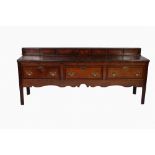 EIGHTEENTH CENTURY OAK AND MAHOGANY CROSSBANDED DRESSER, the oblong three plank top surmounted by