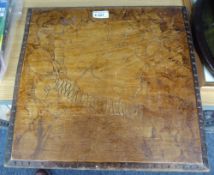 A LATE VICTORIAN/EDWARDIAN POKER-WORK DECORATED WOODEN EASEL SUPPORT PANEL