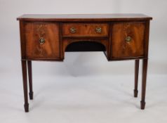 'MAPLE', GEORGIAN STYLE FIGURED AND CROSSBANDED MAHOGANY BOW FRONTED SMALL SIDEBOARD, the shaped