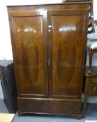 AN EDWARDIAN INLAID MAHOGANY TWO DOOR WARDROBE WITH BASAL DRAWERS