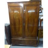 AN EDWARDIAN INLAID MAHOGANY TWO DOOR WARDROBE WITH BASAL DRAWERS