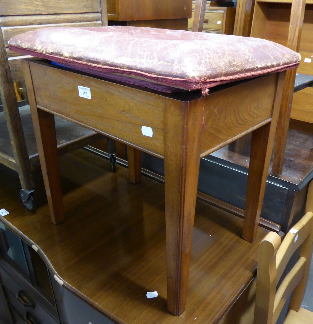 A MAHOGANY OBLONG PIANO STOOL, THE BOX SEAT WITH HINGED LID UPHOLSTERED IN HIDE