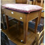 A MAHOGANY OBLONG PIANO STOOL, THE BOX SEAT WITH HINGED LID UPHOLSTERED IN HIDE