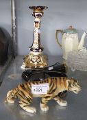 A BLACK POTTERY WALL POCKET, AN IMARI PAINTED PORCELAIN CANDLESTICK AND A POTTERY MODEL OF TIGER