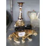 A BLACK POTTERY WALL POCKET, AN IMARI PAINTED PORCELAIN CANDLESTICK AND A POTTERY MODEL OF TIGER