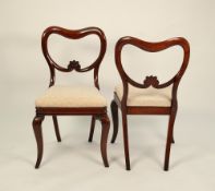 SET OF FOUR VICTORIAN CARVED MAHOGANY DINING CHAIRS, each with open buckle type back with foliate