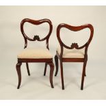 SET OF FOUR VICTORIAN CARVED MAHOGANY DINING CHAIRS, each with open buckle type back with foliate