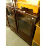 A PAIR OF MAHOGANY SMALL CABINETS, EACH ENCLOSED BY A GLAZED DOOR