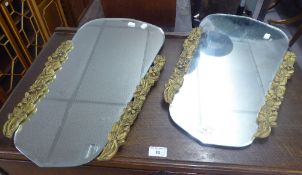 A PAIR OF WALL MIRRORS, SHAPED WITH GILT FLORAL EDGE PANELS (2)