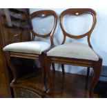 A PAIR OF VICTORIAN MAHOGANY BALLOON BACK SINGLE CHAIRS, ON CABRIOLE FRONT SUPPORTS