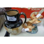 A ROYAL DOULTON LAMBETH 'DEWARS' PERTH WHISKY JUG AND BESWICK FIGURINE GROUP WITH TWO PERCHED