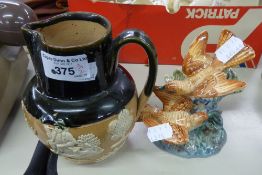 A ROYAL DOULTON LAMBETH 'DEWARS' PERTH WHISKY JUG AND BESWICK FIGURINE GROUP WITH TWO PERCHED