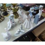 SEVEN NAO FIGURES, GIRL WITH LION TEDDY, TWO HARLEQUIN FIGURES, TWO ORNAMENTS OF GEESE AND TWO