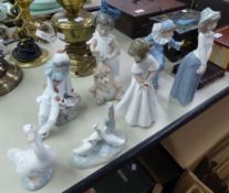 SEVEN NAO FIGURES, GIRL WITH LION TEDDY, TWO HARLEQUIN FIGURES, TWO ORNAMENTS OF GEESE AND TWO