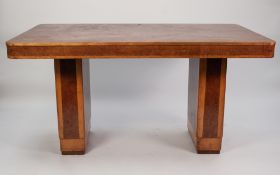 A STYLISHLY ART DECO POLLARD OAK AND SYCAMORE DINING TABLE, the top with rounded corners above a
