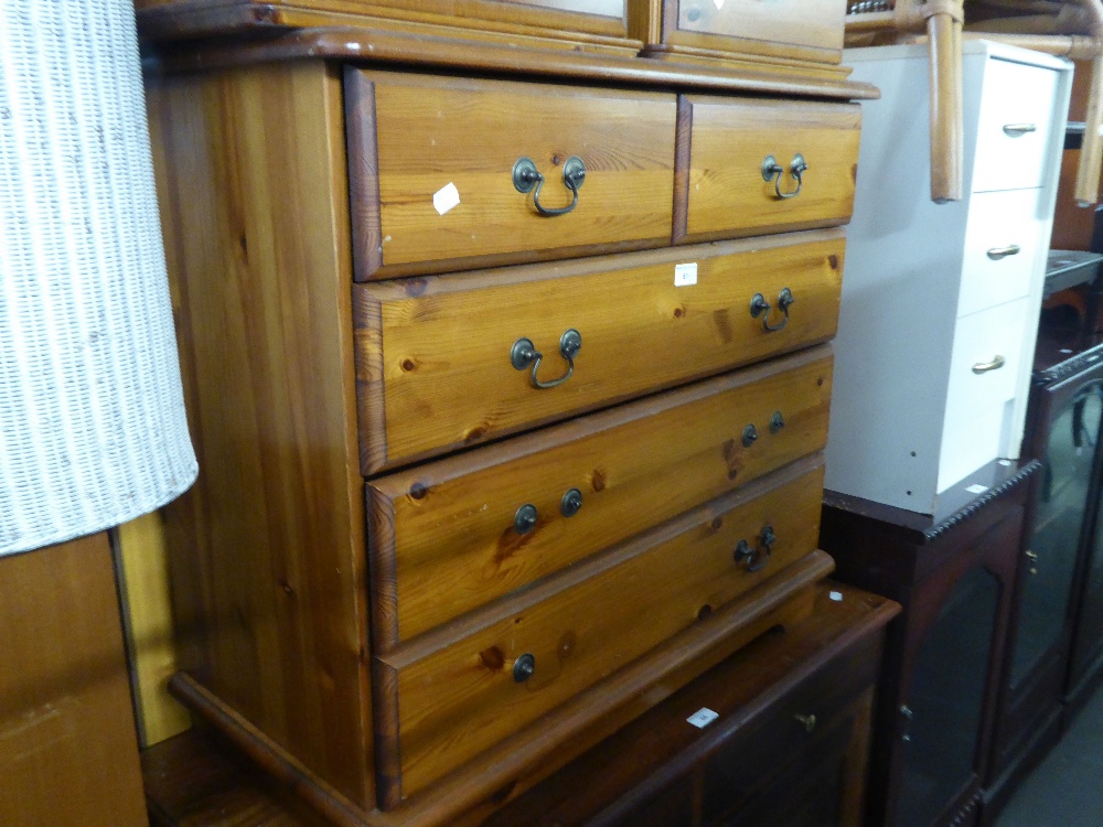 A PINE CHEST OF TWO SHORT AND TWO LONG DRAWERS AND A PINE WARDROBE WITH TWO PLANKED DOORS (2)