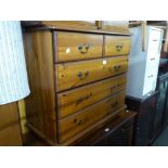 A PINE CHEST OF TWO SHORT AND TWO LONG DRAWERS AND A PINE WARDROBE WITH TWO PLANKED DOORS (2)