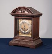 EARLY TWENTIETH CENTURY JUNGHANS, GERMAN OAK CASED MANTLE CLOCK, the 6" brass dial with silvered