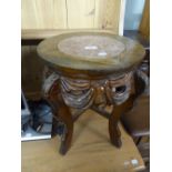 AN ORIENTAL CARVED PADOUK WOOD URN STAND WITH INSET MARBLE TOP