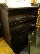 A BLACK STAINED WOOD FIVE TIER OPEN BOOKCASE