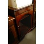 A MAHOGANY SMALL CABINET WITH GLAZED DOOR