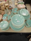 A POOLE POTTERY DINNER SERVICE FOR SIX PERSONS, PALE GREEN, APPROX 50 PIECES