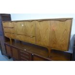 SUTCLIFFE, TODMORDEN TEAK SIDEBOARD HAVING OUT TURNED EDGE HANDLES, CENTRAL FALL FRONT OVER LONG