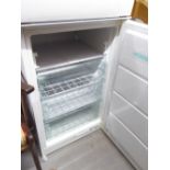 AN INTEGRATED UPRIGHT FREEZER