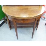 EARLY NINETEENTH CENTURY LINE INLAID MAHOGANY DEMI-LUNE FOLD OVER TEA TABLE, raised on square,