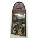 AN OAK FRAMED MIRROR, HAVING CARVED SHIP DECORATION TO THE TOP PANEL