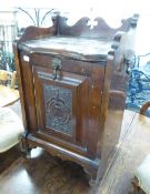 AN ANTIQUE MAHOGANY COAL PURDONIUM WITH FALL FRONT AND GALLERY BACK