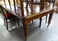 VICTORIAN LARGE DINING TABLE HAVING ROUNDED CORNERS ALL RAISED ON TURNED FLUTED SUPPORTS AND