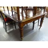 VICTORIAN LARGE DINING TABLE HAVING ROUNDED CORNERS ALL RAISED ON TURNED FLUTED SUPPORTS AND