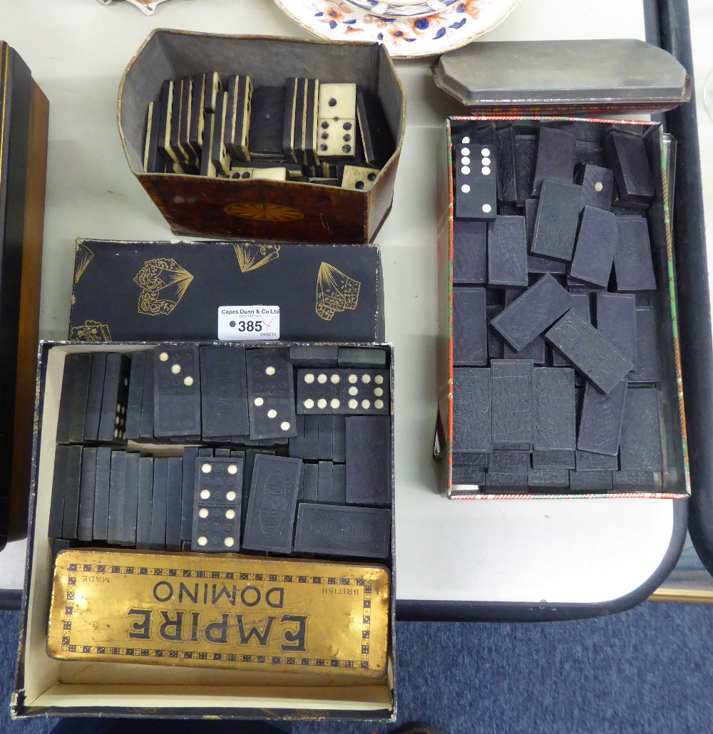 AN EBONY AND BONE DOMINO SET AND TWO OTHER SETS