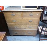 A LATE VICTORIAN OAK CHEST OF DRAWERS