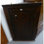 VICTORIAN OAK CORNER CUPBOARD HAVING SOLID PANEL DOOR ENCLOSED THREE SHAPED SHELVES