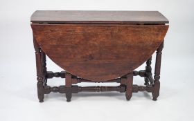 EIGHTEENTH CENTURY OAK DROP LEAF GATELEG DINING TABLE, the oval top above an end drawer with brass
