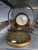 A BRASS DINNER GONG ON OAK OBLONG BASE AND THE BEATER AND AN OAK MANTEL CLOCK WITH STRIKING MOVEMENT