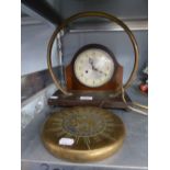 A BRASS DINNER GONG ON OAK OBLONG BASE AND THE BEATER AND AN OAK MANTEL CLOCK WITH STRIKING MOVEMENT