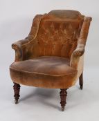 LATE VICTORIAN UPHOLSTERED TUB SHAPED LOW ARMCHAIR, with deep buttoned back enclosed by conforming